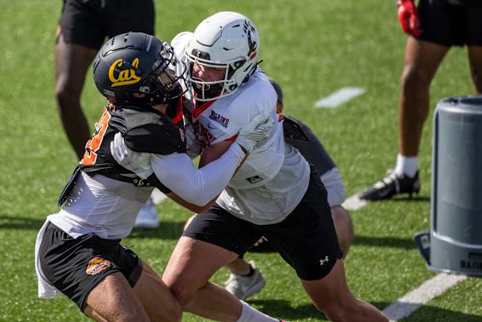 Jan 31, 2023; Mobile, AL, USA; National defensive back Daniel Scott of California (22) practices with National tight end Josh Whyle of Cincinnati (81) during the first day of Senior Bowl week at Hancock Whitney Stadium in Mobile. Mandatory Credit: Vasha Hunt-USA TODAY Sports
